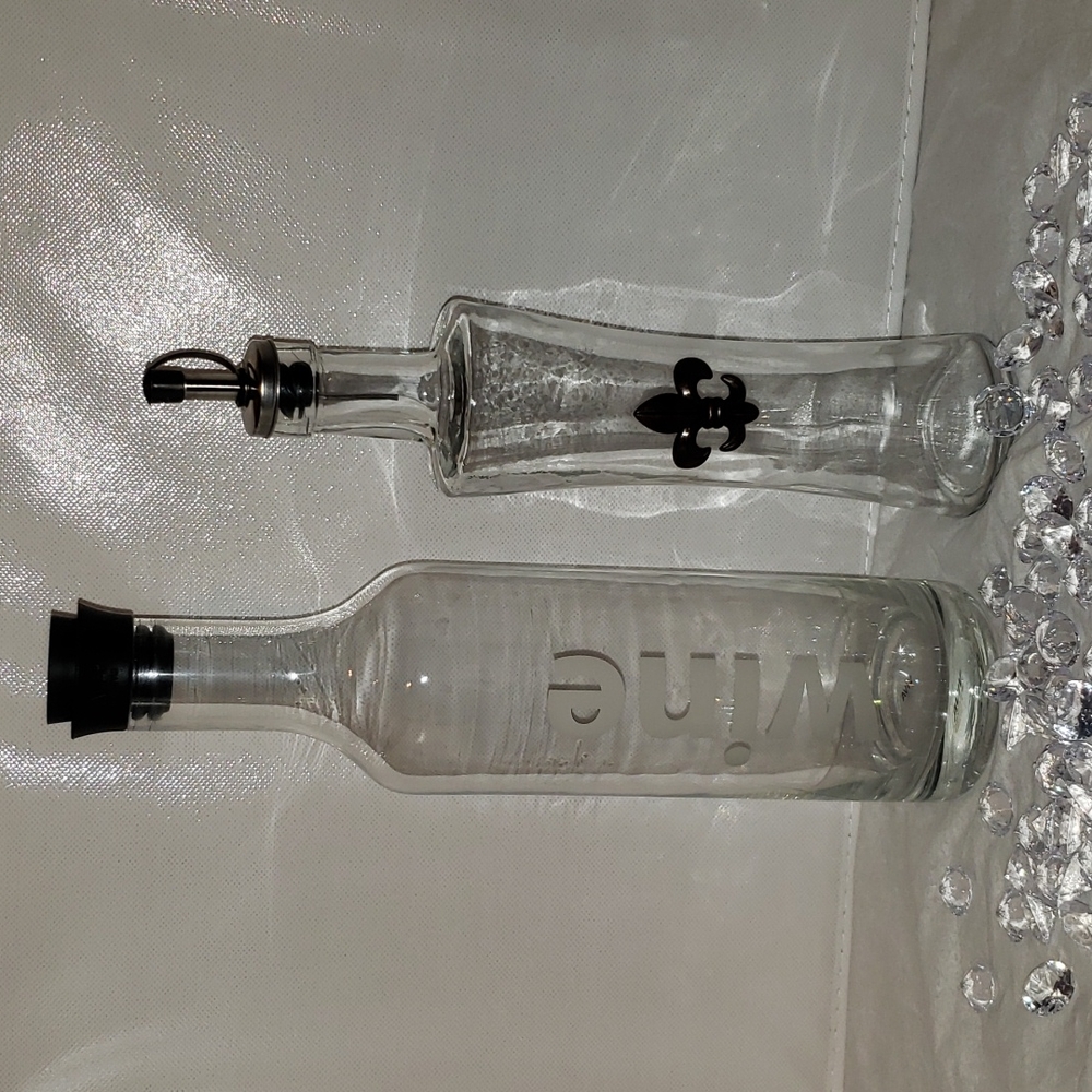 2 glass decanters.   VIVA Wine.  PALAIS Oil & Vivitar.  fleur de lis.
